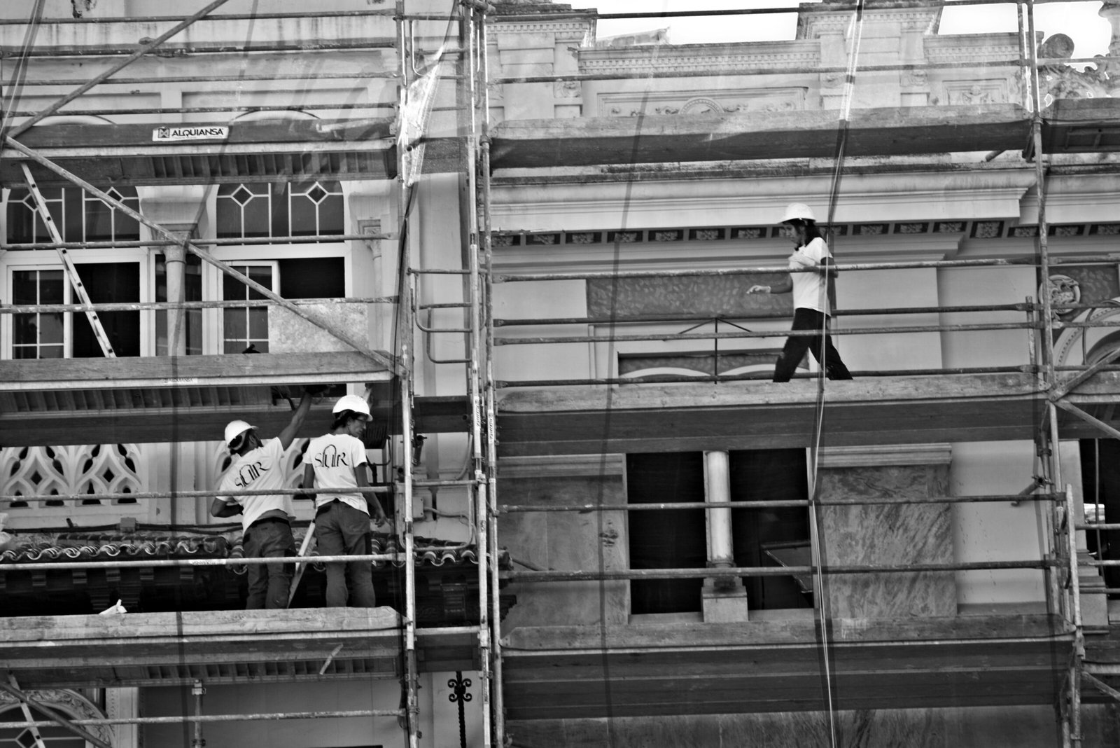 a group of men on a building